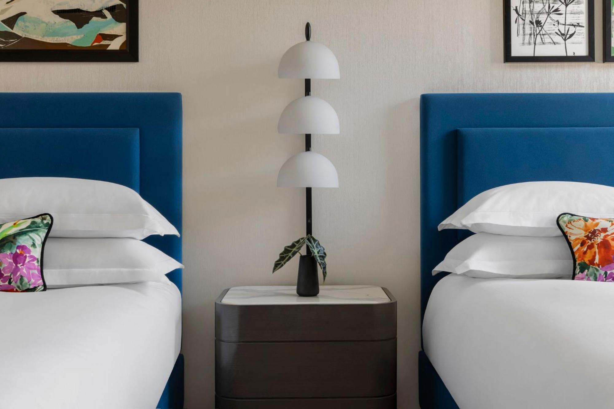 Essential Queen Room with Two Queen Beds and City View