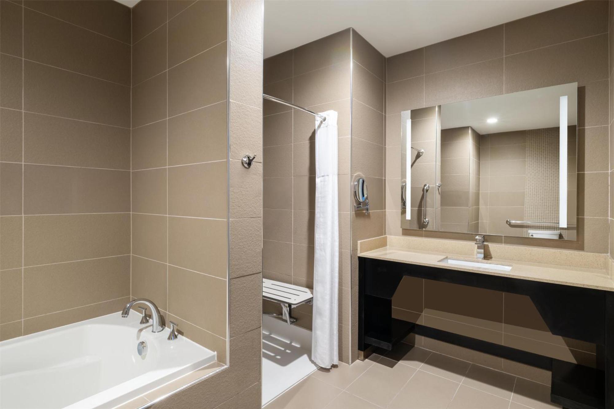 King Suite with Roll-In Shower, Sofa Bed and Separate Living Area - Disability/Non-Smoking